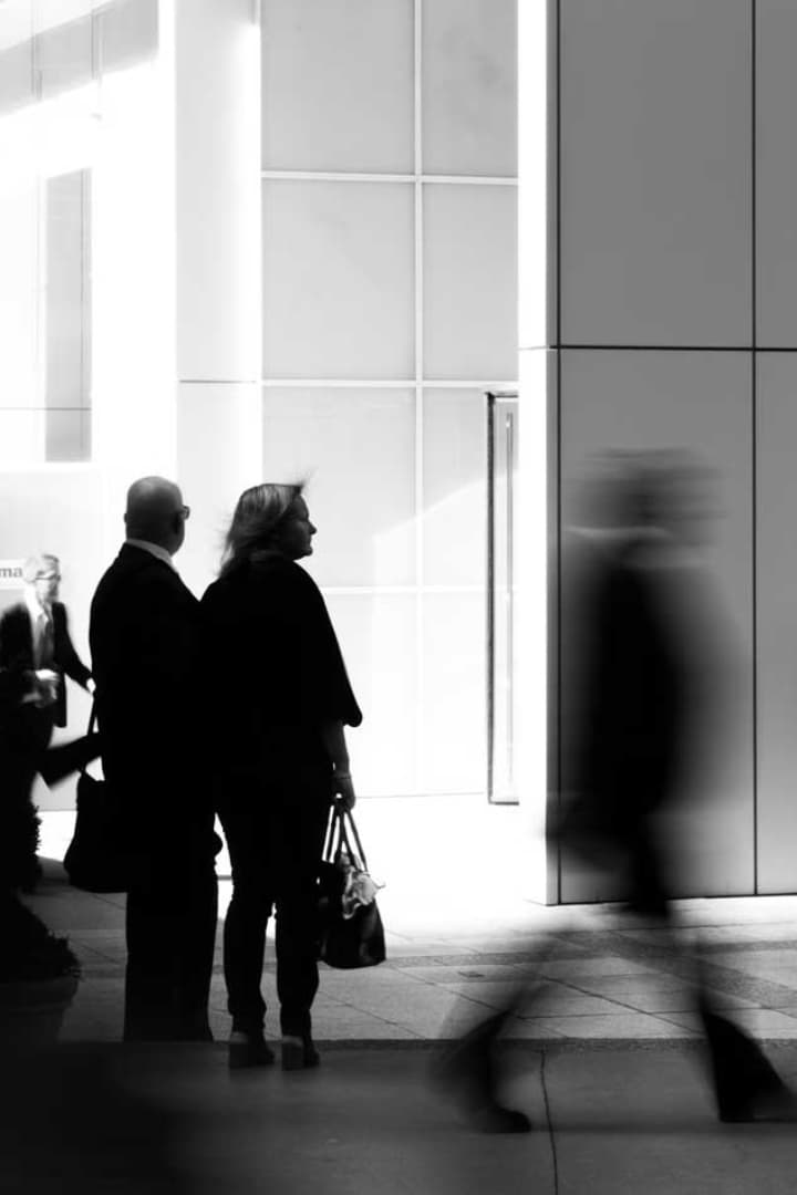People walking through a London office lobby